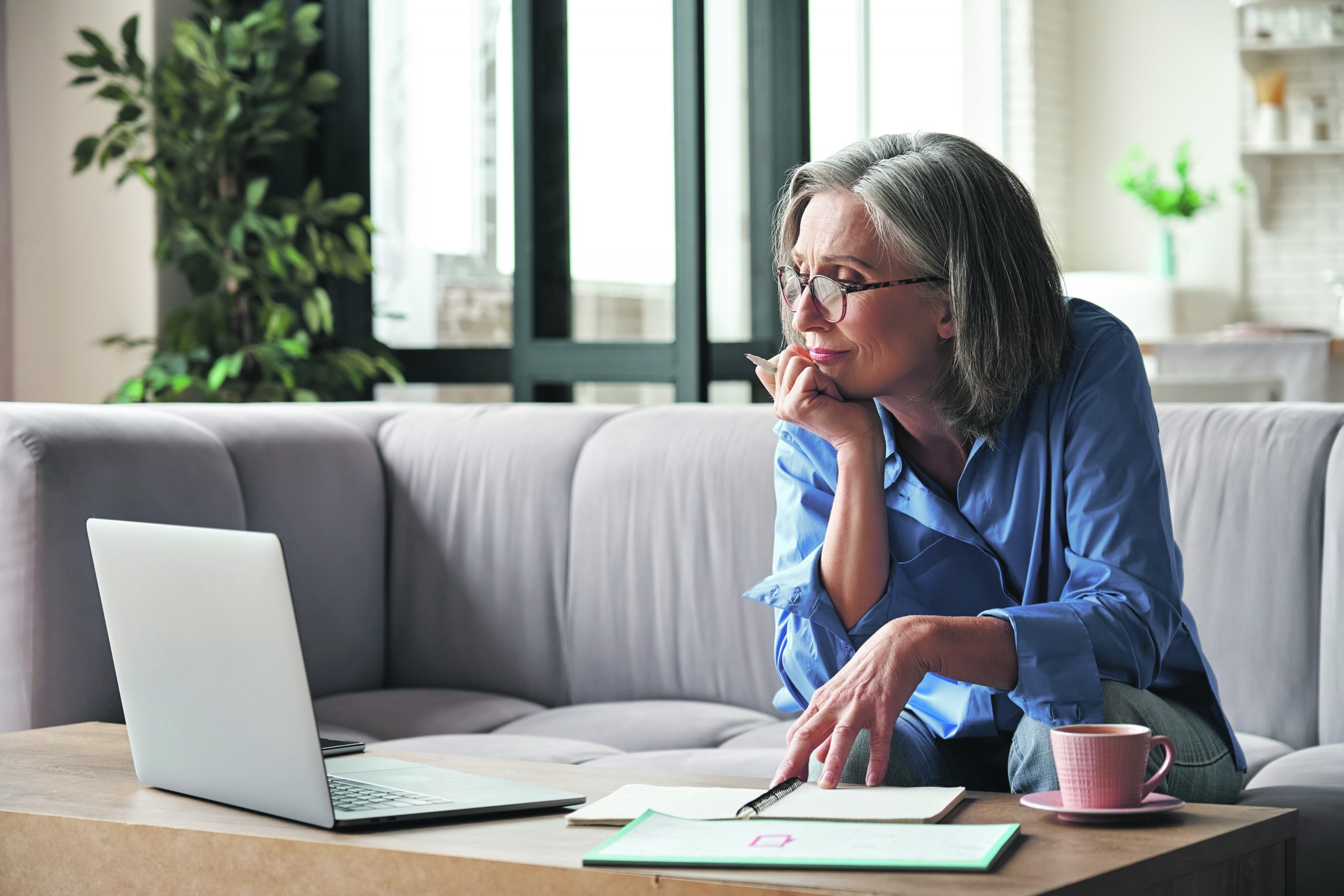 A woman reviews her finances and options for retirement.