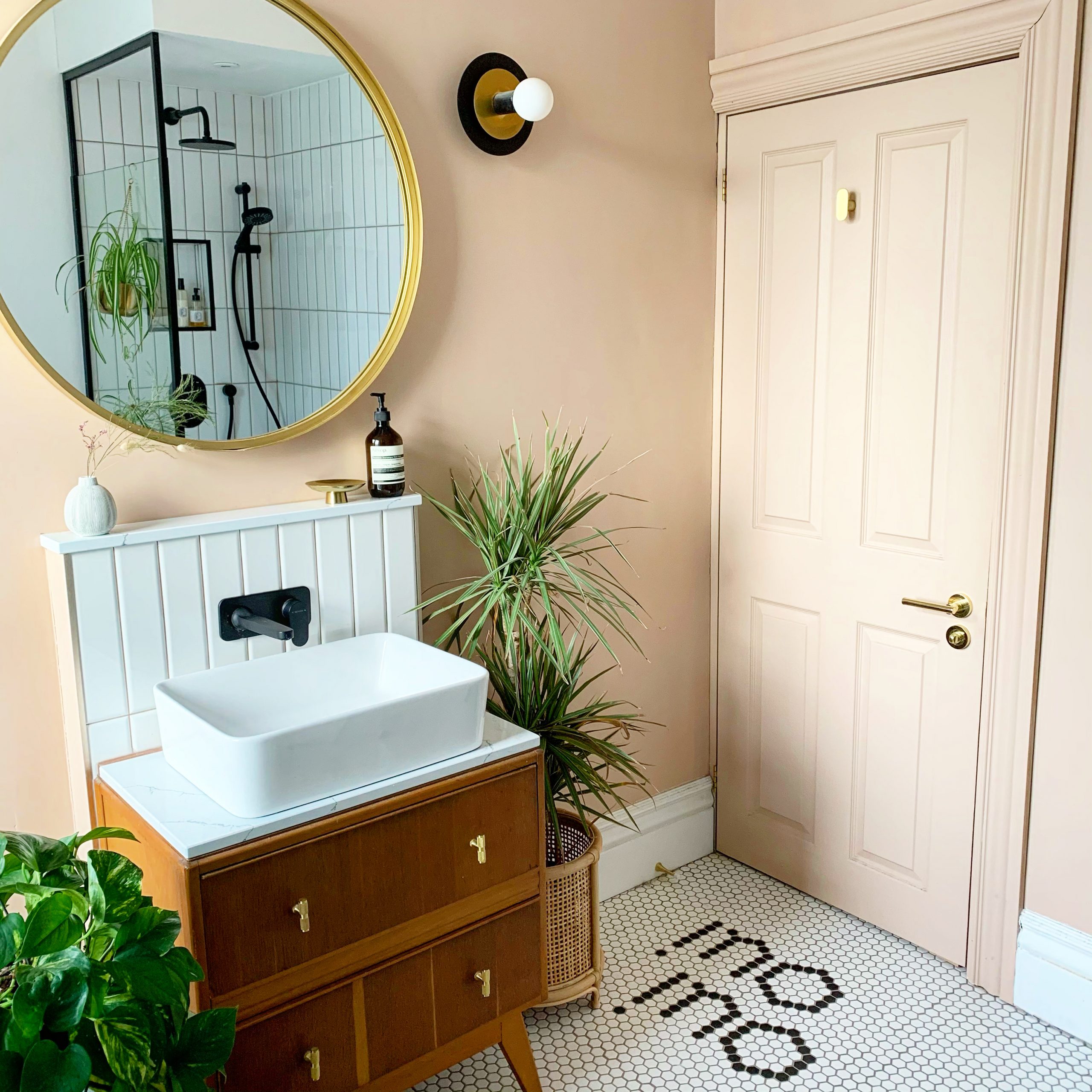 A modern bathroom renovation with plants by interior designers Renovating Love Lane