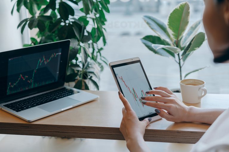 Researching to invest in eco-friendly companies.