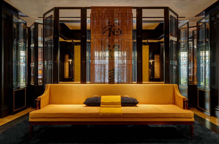 A stylish black and brown living room with a khaki sofa