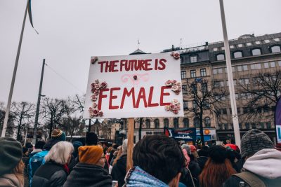 A crowd protesting equal rights for women.