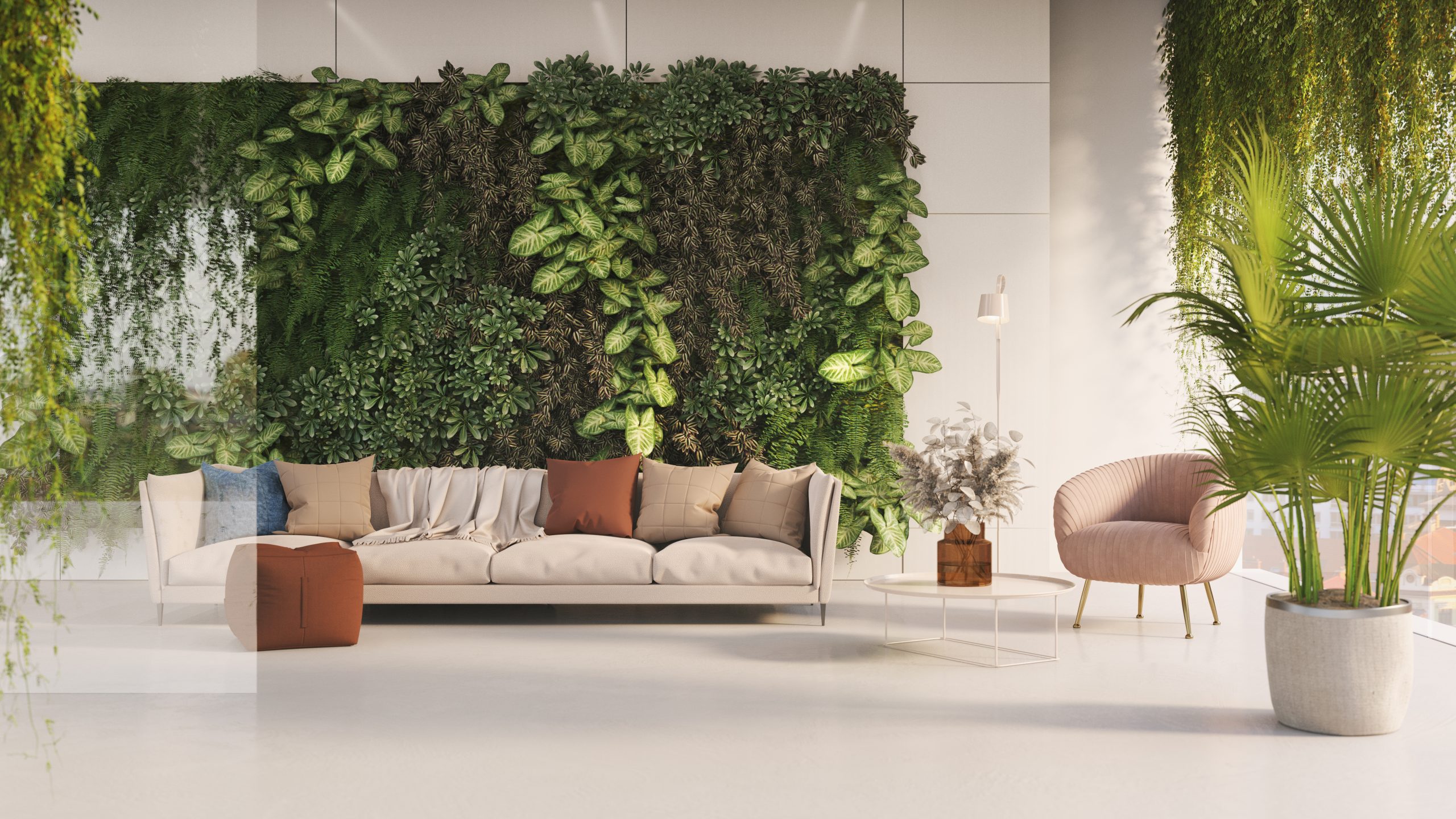 A large green living wall behind a sofa brings colour to a spacious living room.