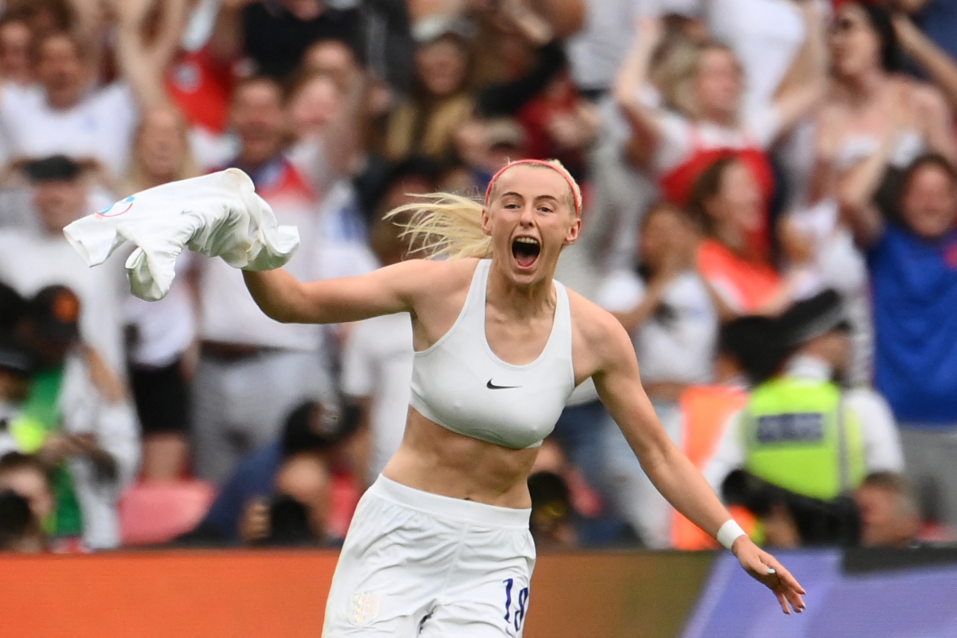 Football striker Chloe Kelly celebrating scoring a goal during the UEFA Women's Euro 2022 final football match.