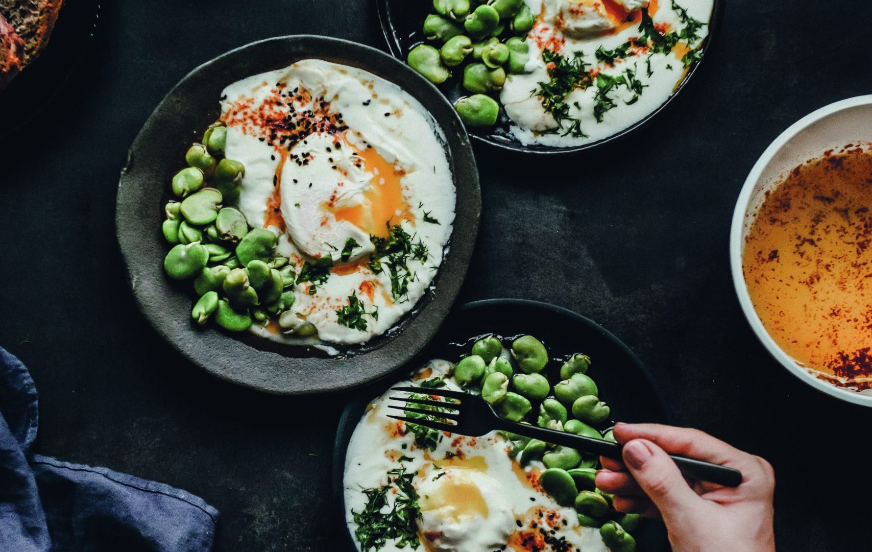 A Turkish breakfast of eggs and broad beans.