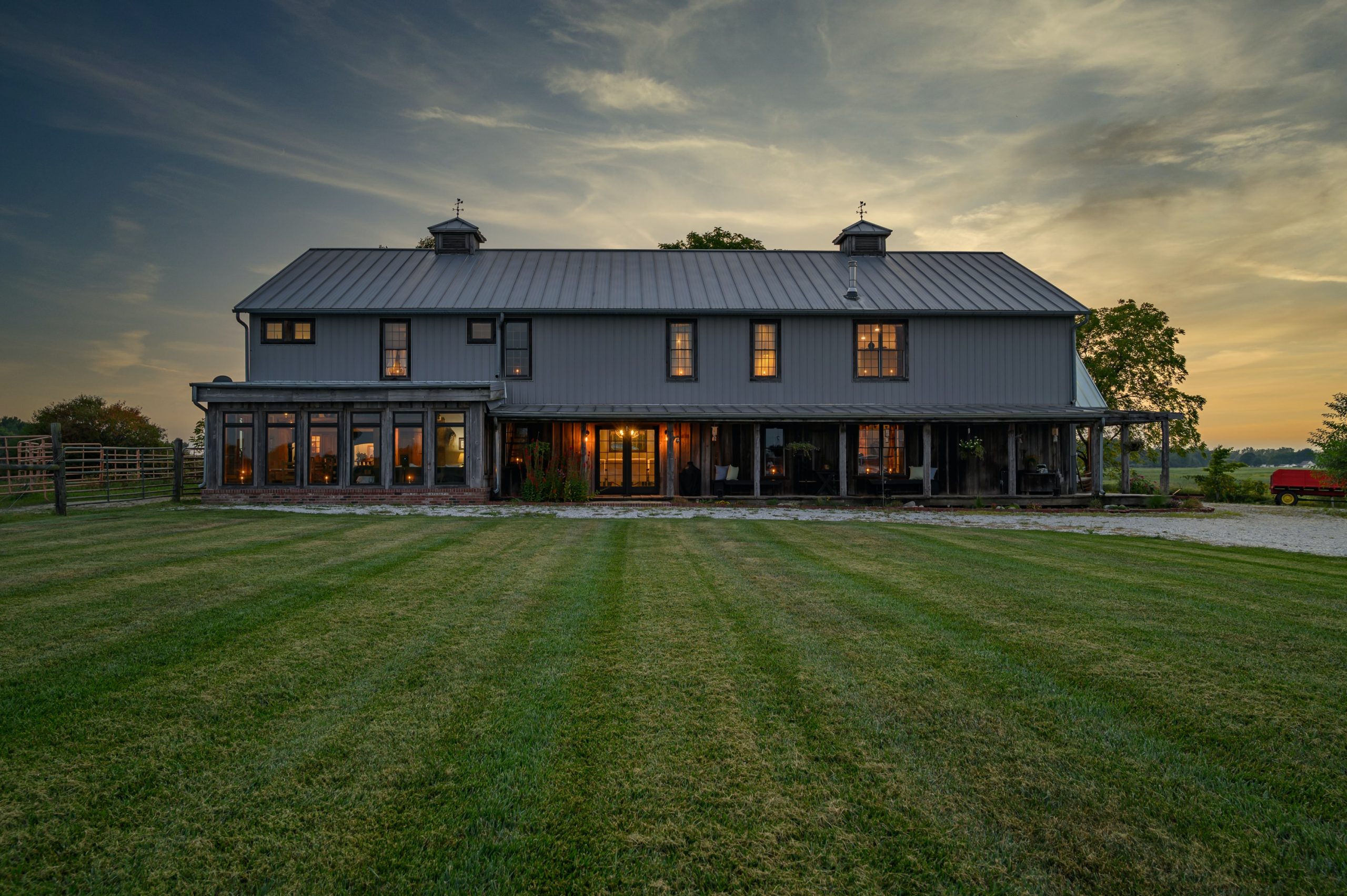 A dream home: a modern two-storey barn conversion with a spacious porch and conservatory.