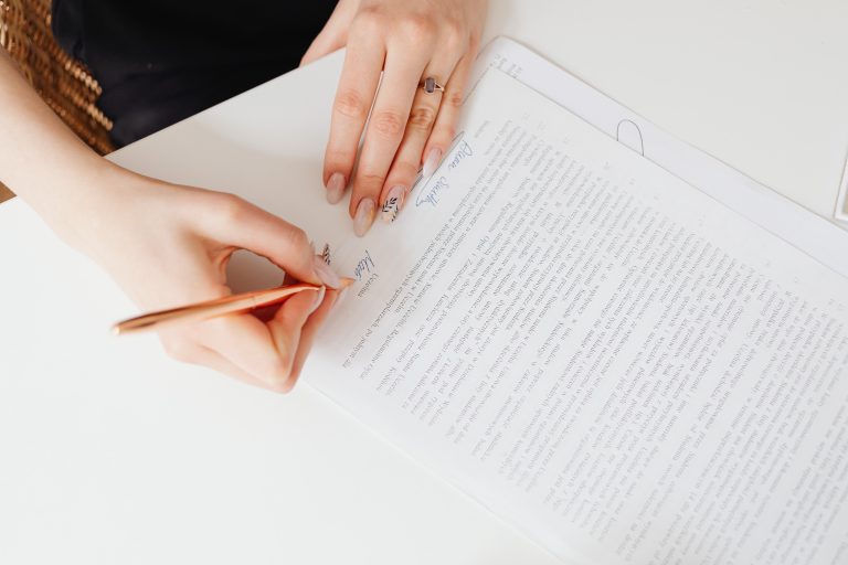Woman's hands signing papers