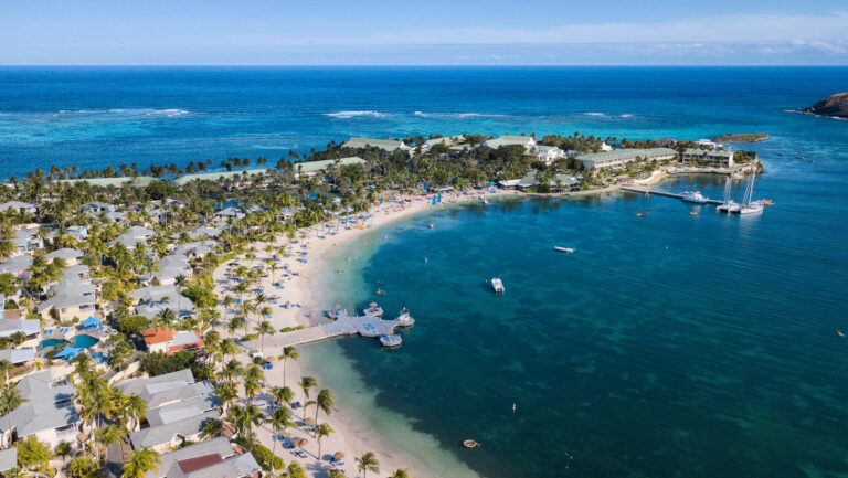 Aerial view of St James Club Antigua with the sea and sky every shade of perfect blue.