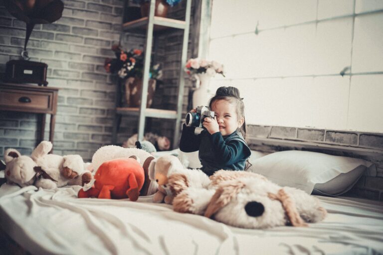 Little girl playing with camera