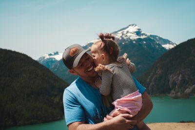 Little girl giving her dad a kiss