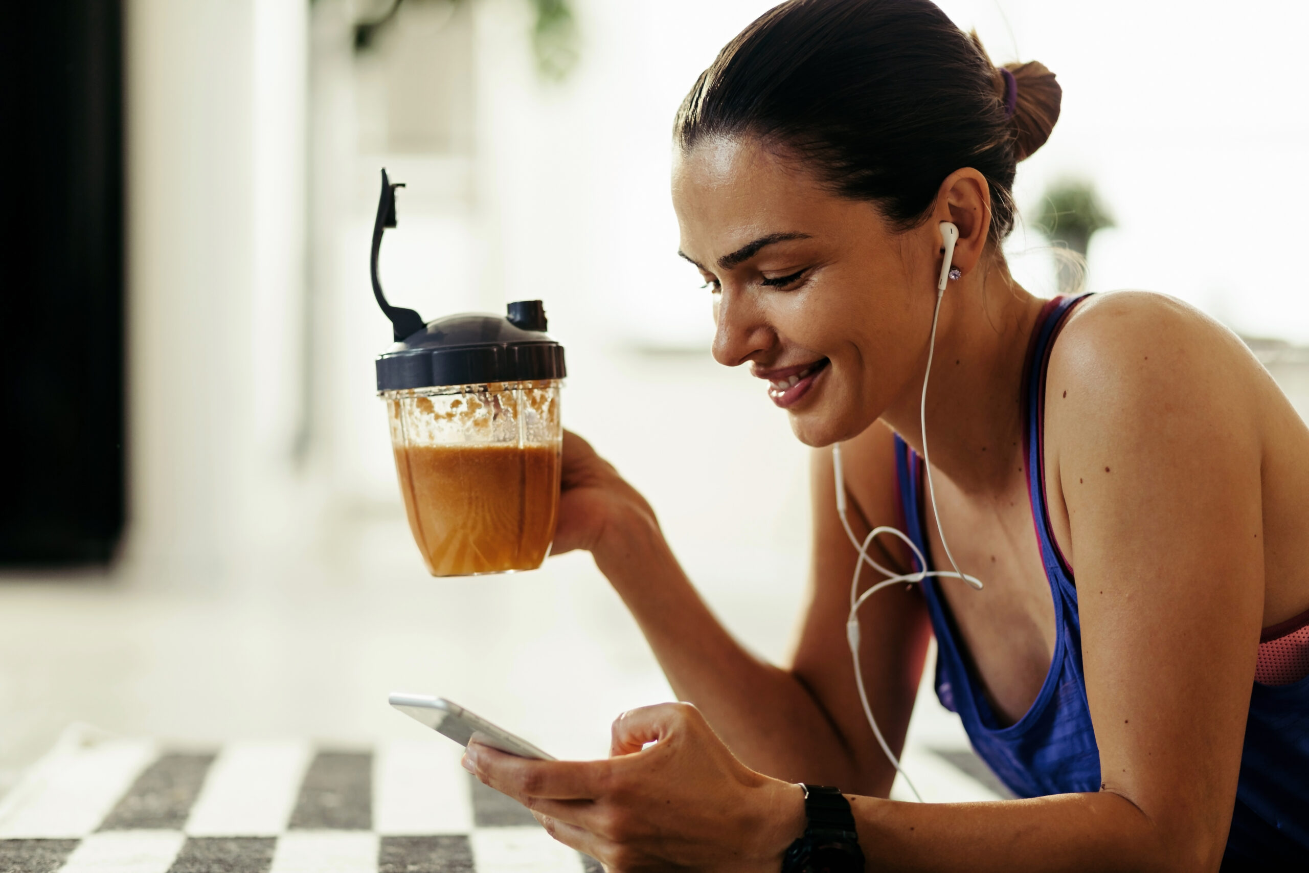 Fitness woman drinking coffee