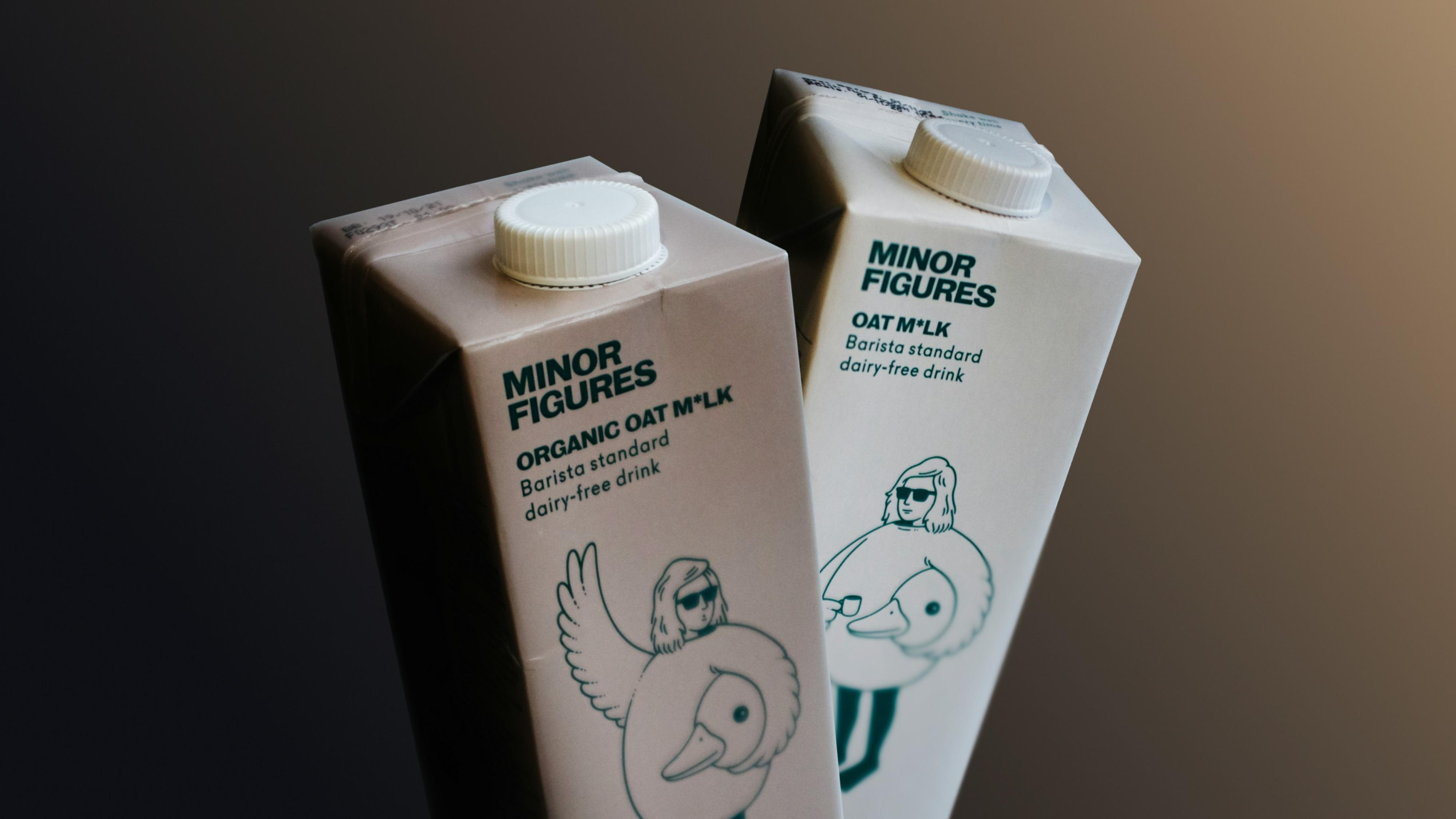Two Minor Figures oat milk bottles next to each other.
