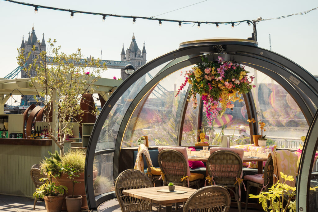 The outdoor igloos at Coppa Club with Tower Bridge behind