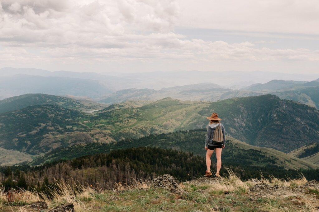 Woman hikes a mountain solo