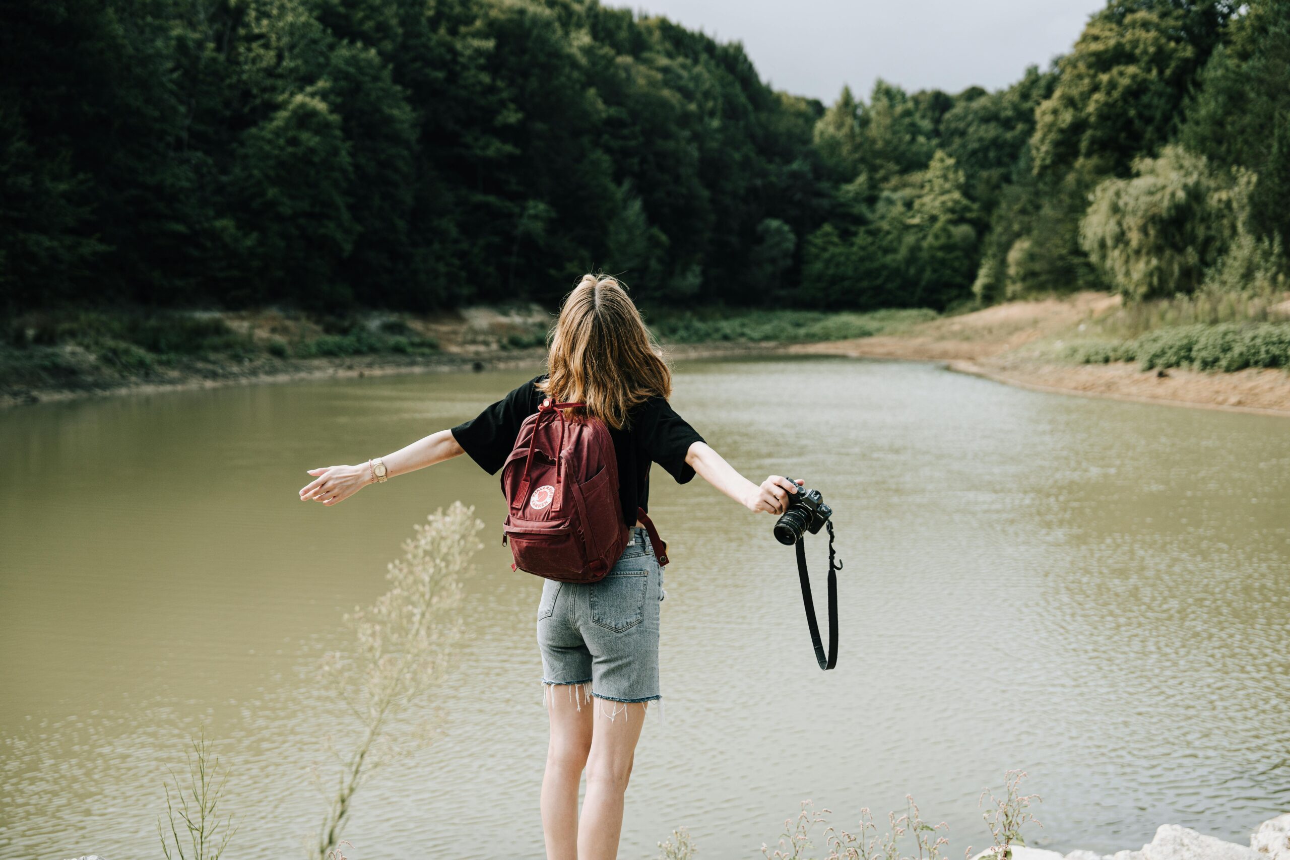 Woman takes pictures of a lake