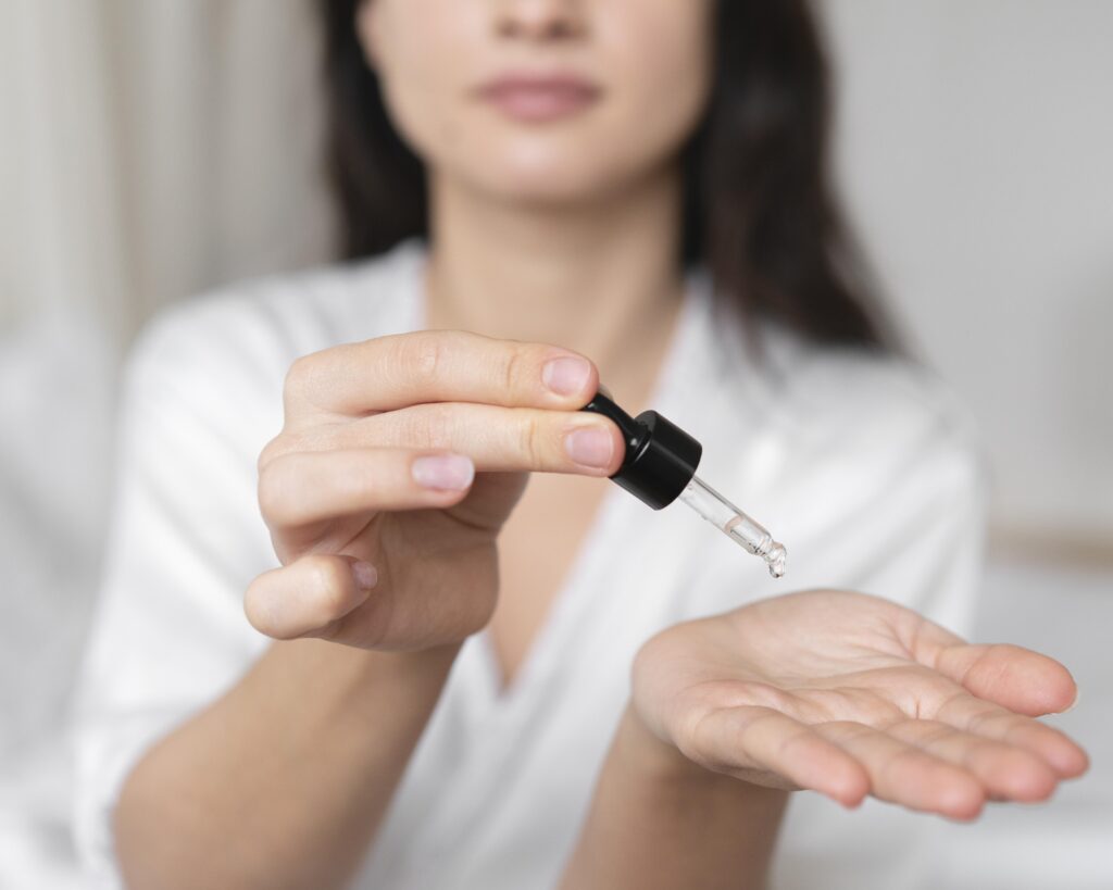 woman drops exosome serum into her hands