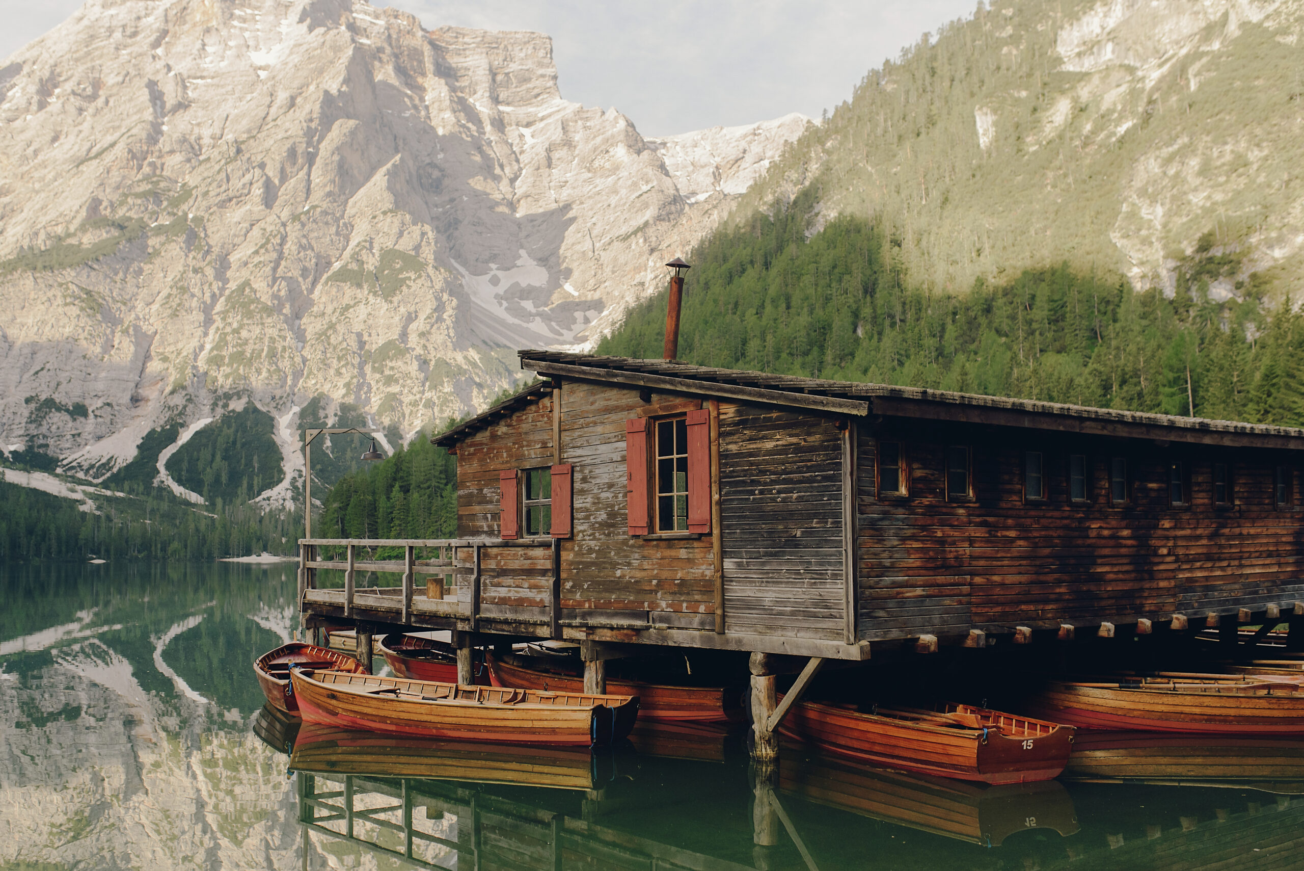 Beautiful wooden house by the lake in Italian Dolomites