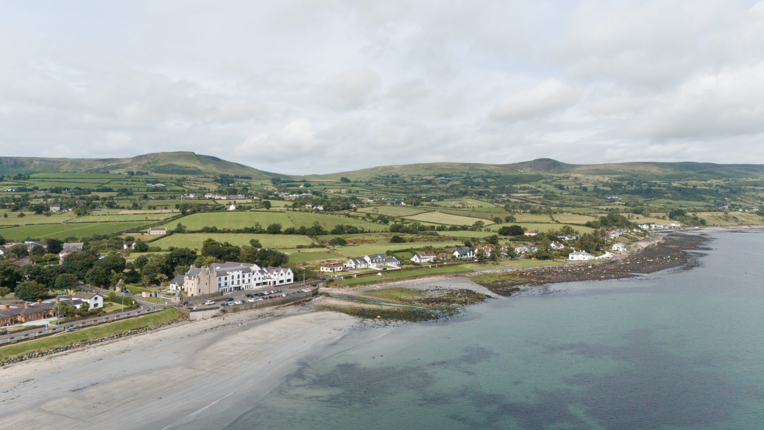 landscape view of sea and shore of Ballygally Bay, Ireland