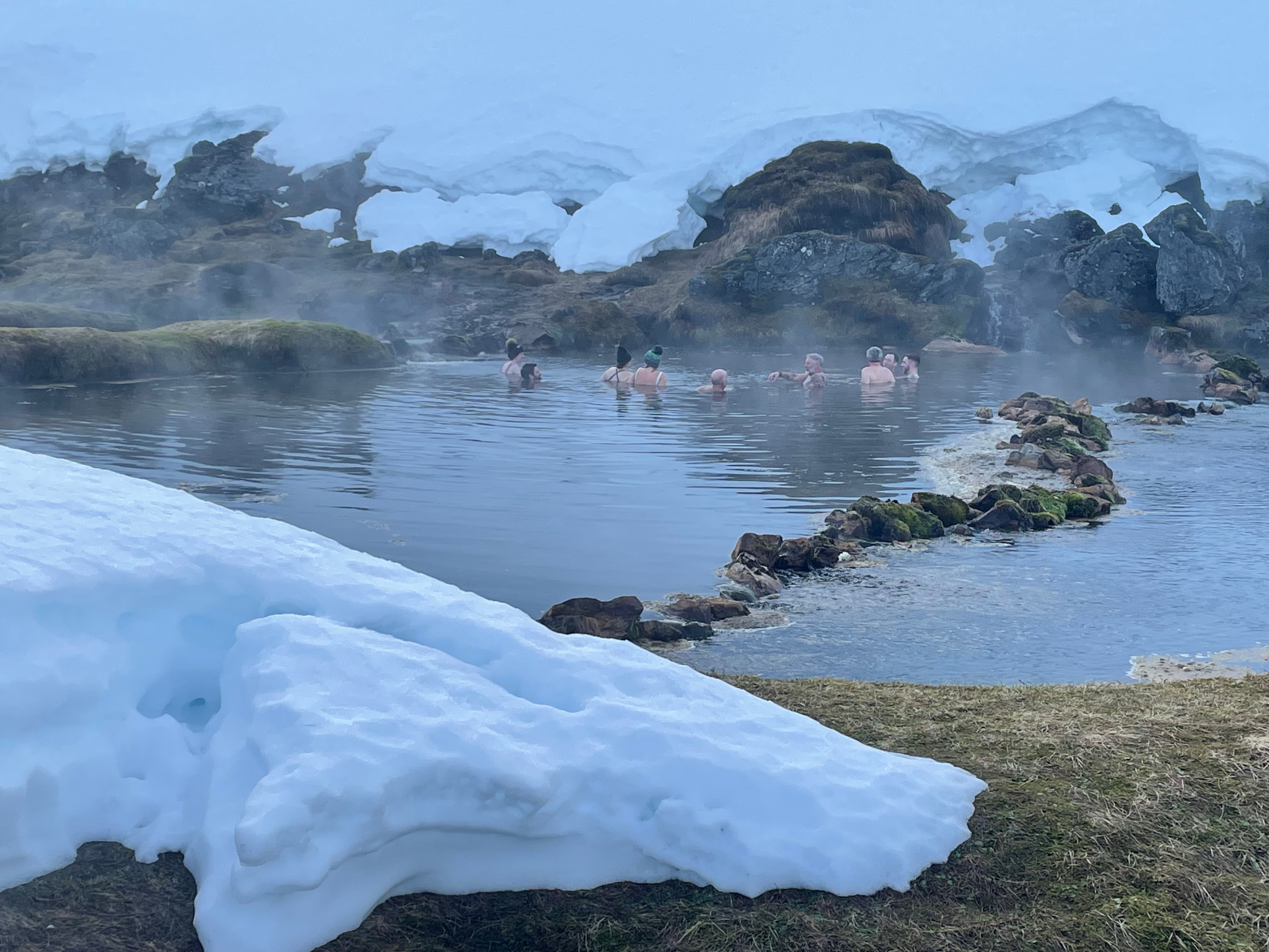 people swimming in a thermal spring in Iceland