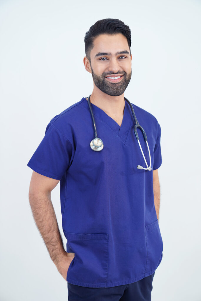 Dr Kaywaan Khan in his scrubs