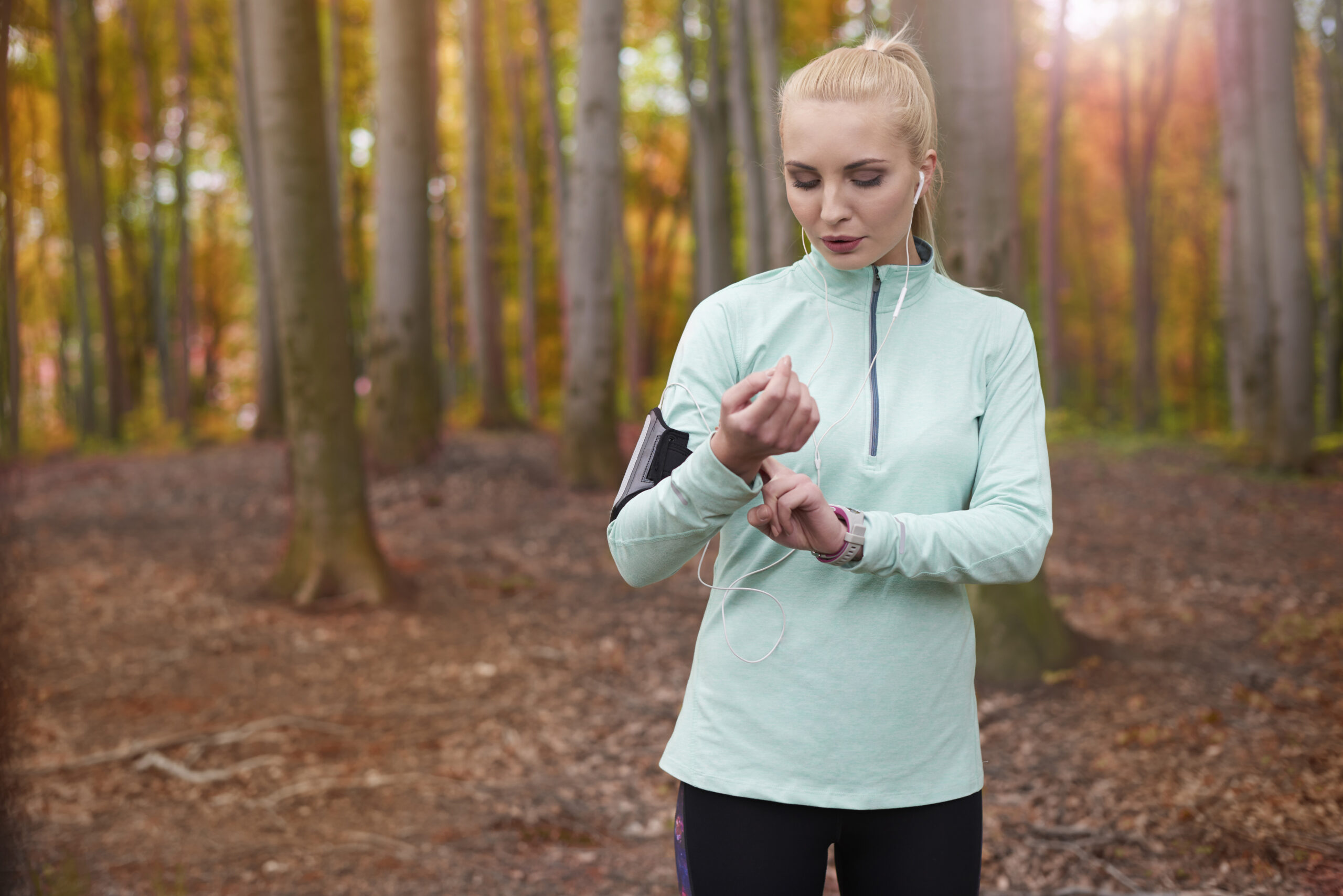 Woman checks her smart watch