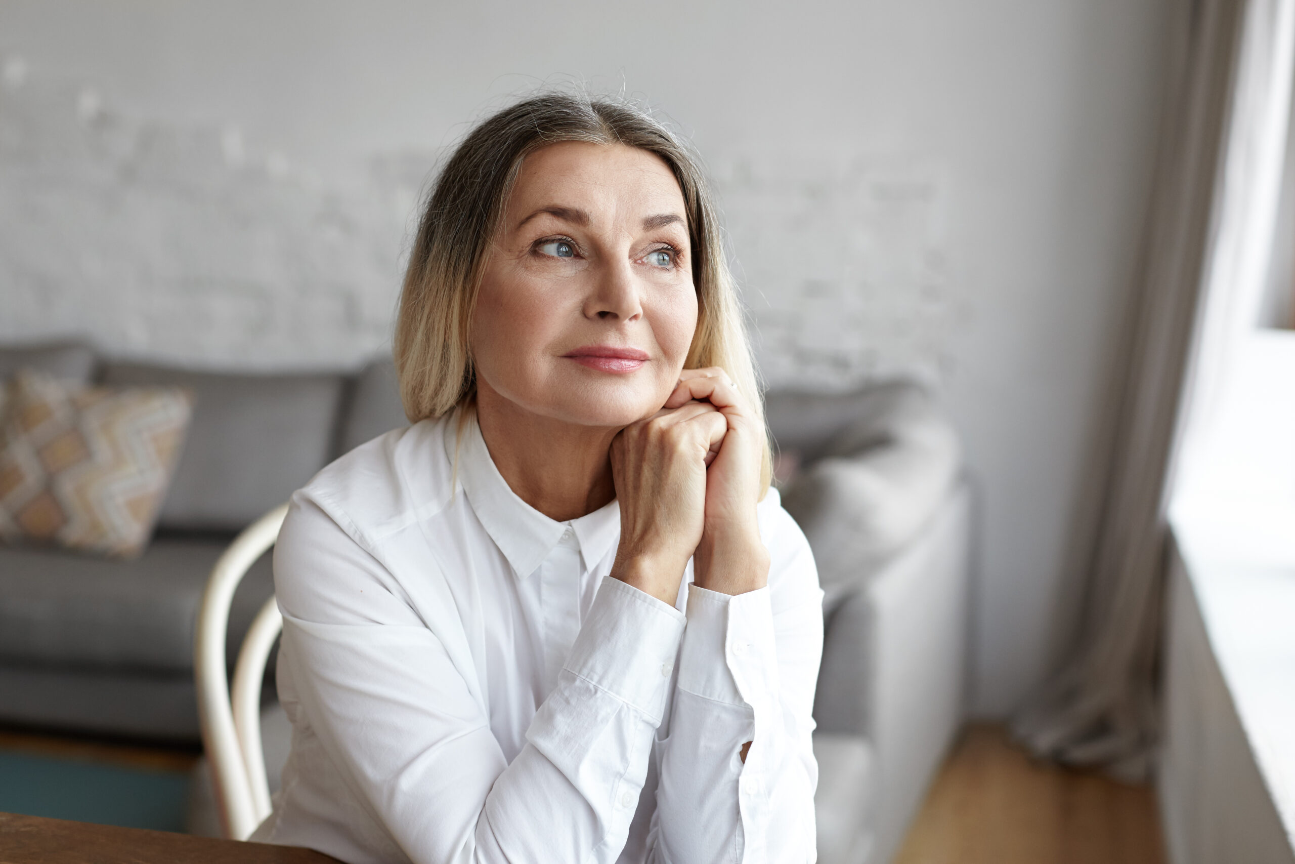 Woman smiles to herself