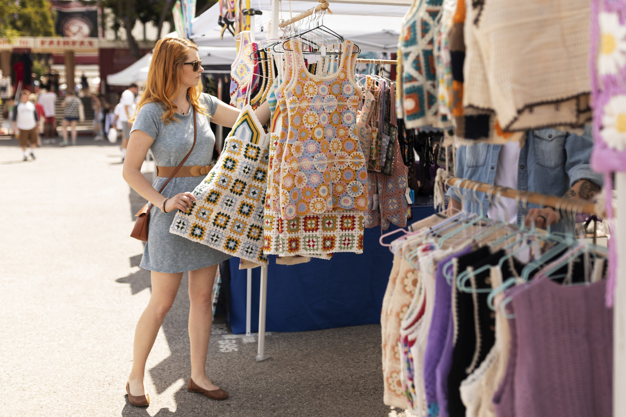 Woman shops for clothes in a market