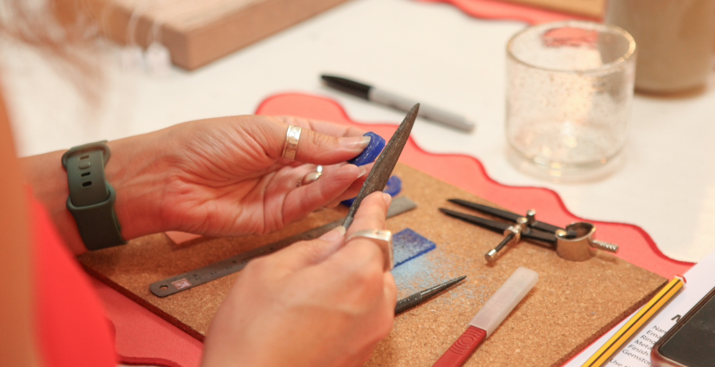 Woman makes a ring at a workshop