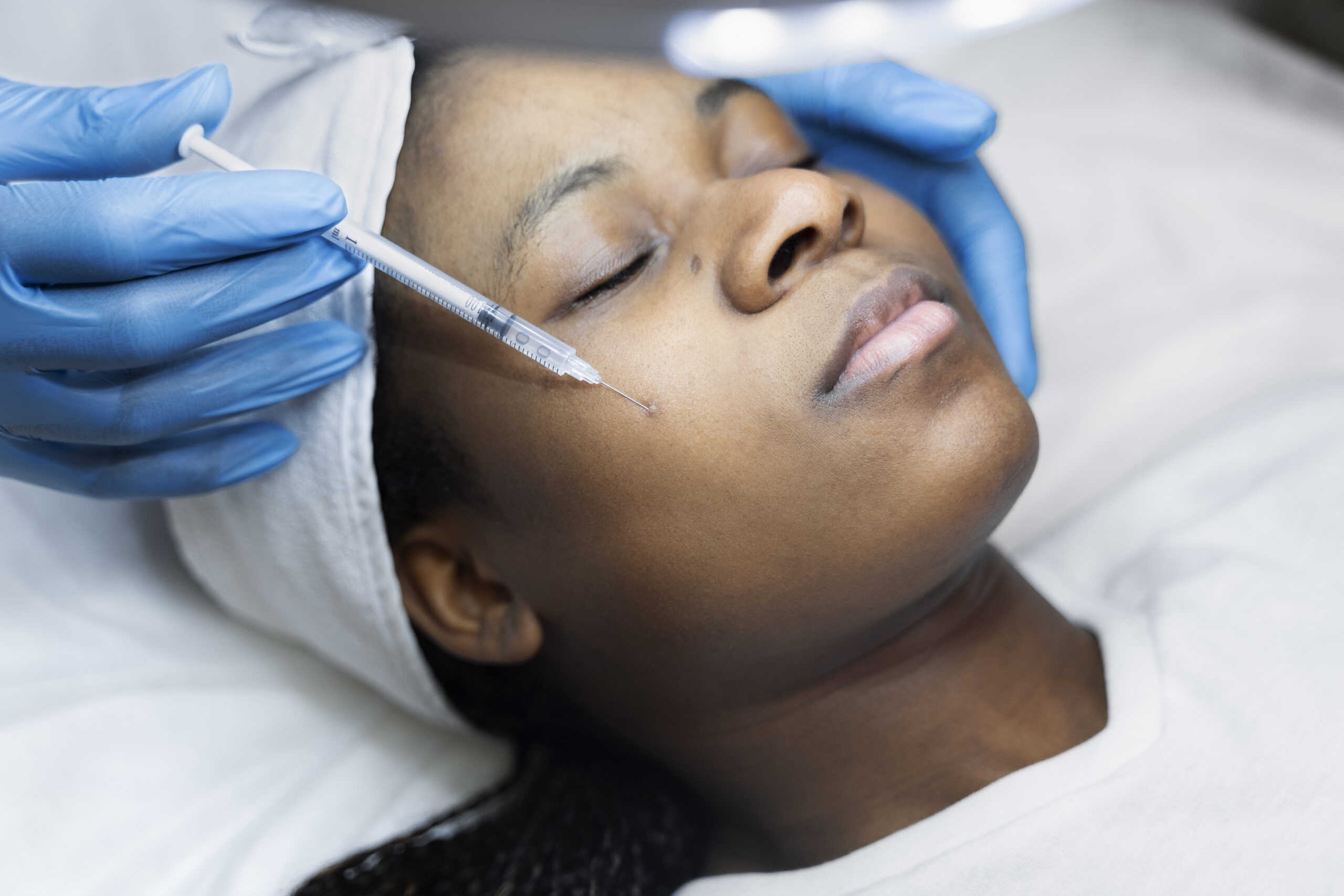 Woman getting face injections