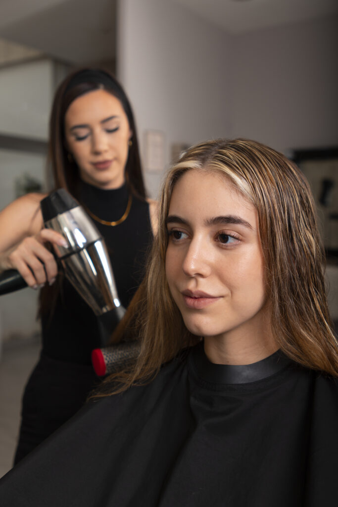 Woman getting her hair done at a salon