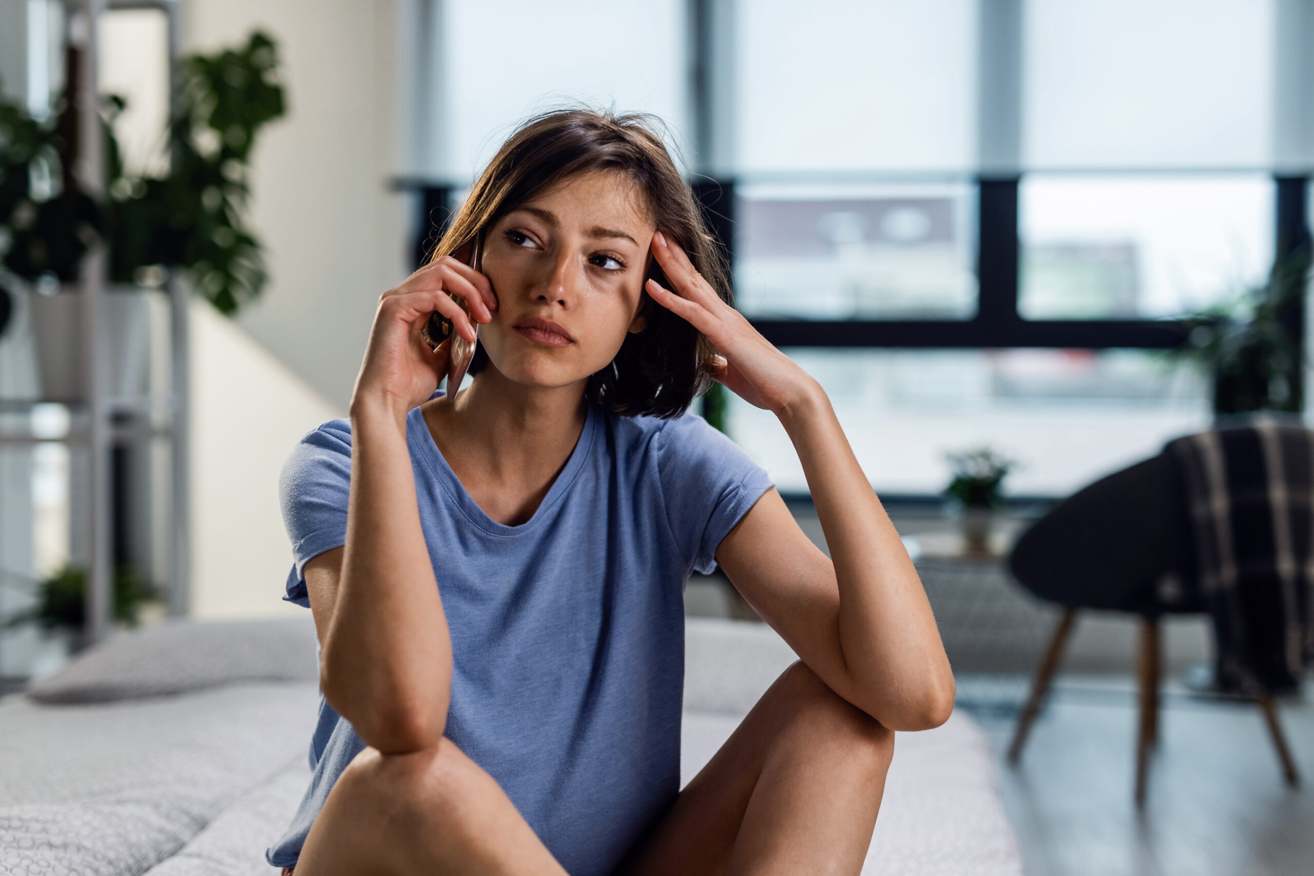 Young woman stressed on the phone