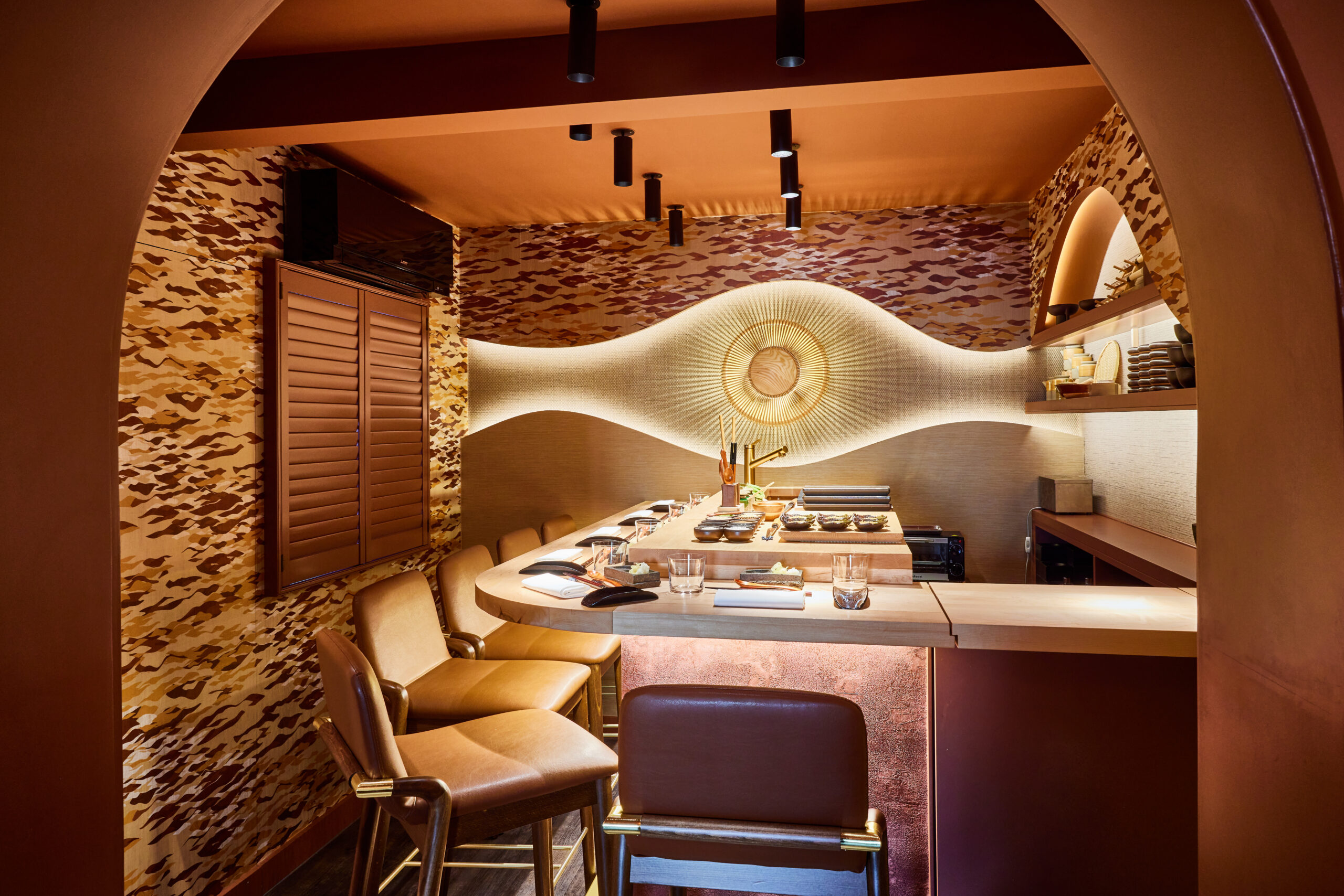 small cavernous room with restaurant and counter with chairs