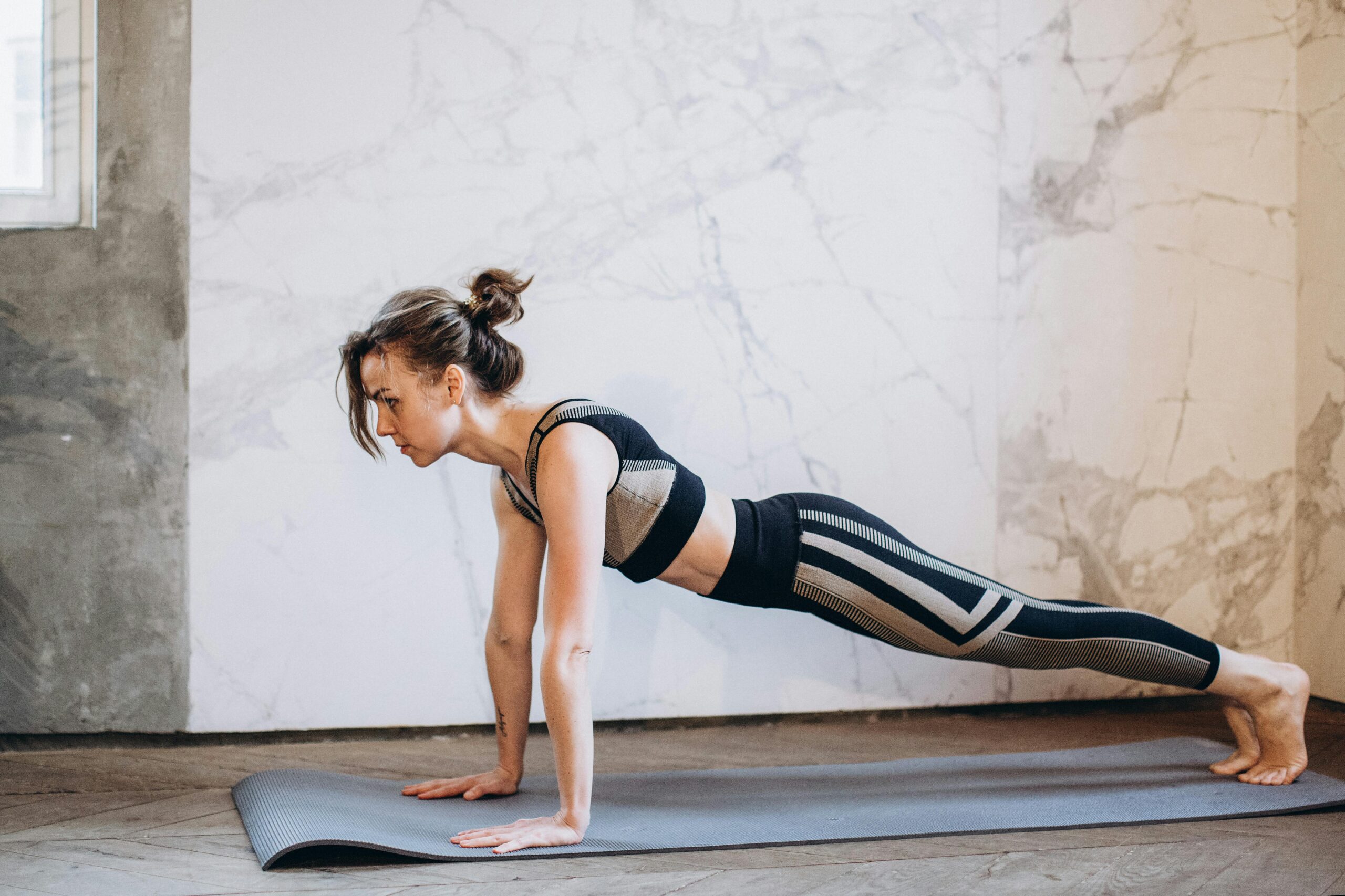 Woman doing plank at home