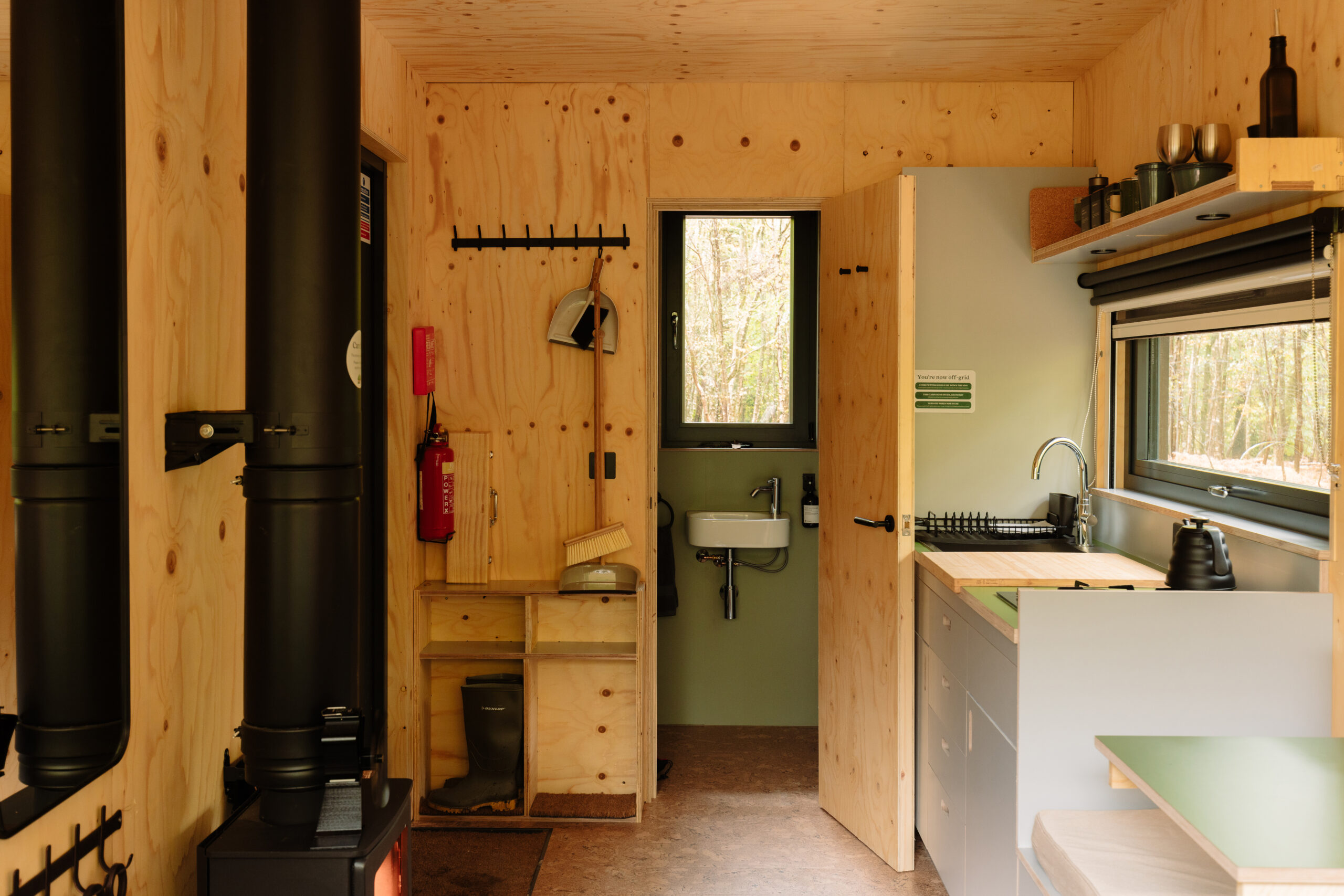 wooden cabin with basic facilities bathroom and log burning fire