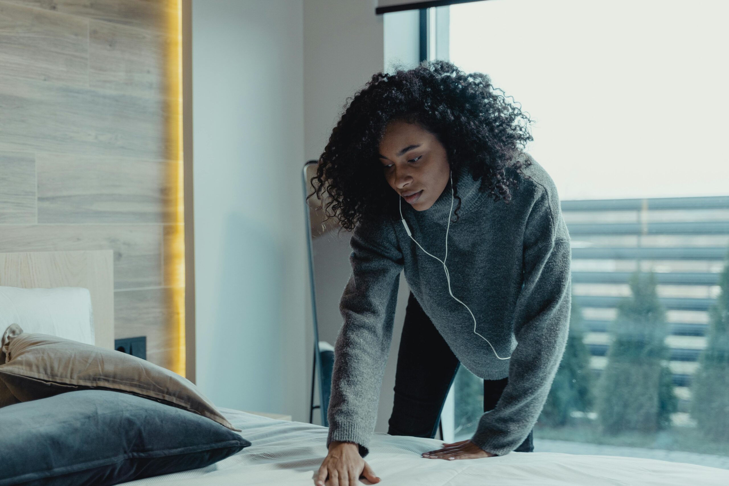 Woman changes her bedding
