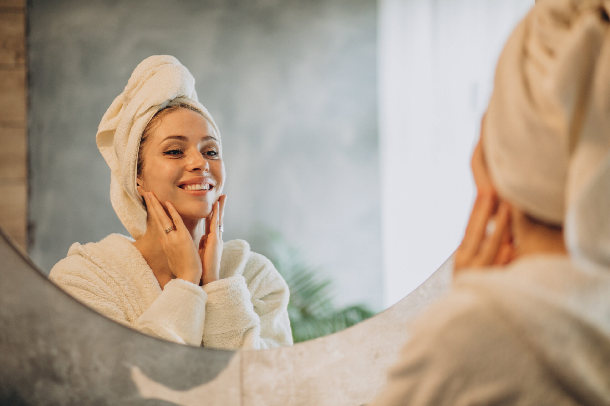 Woman doing skincare in her bathroom