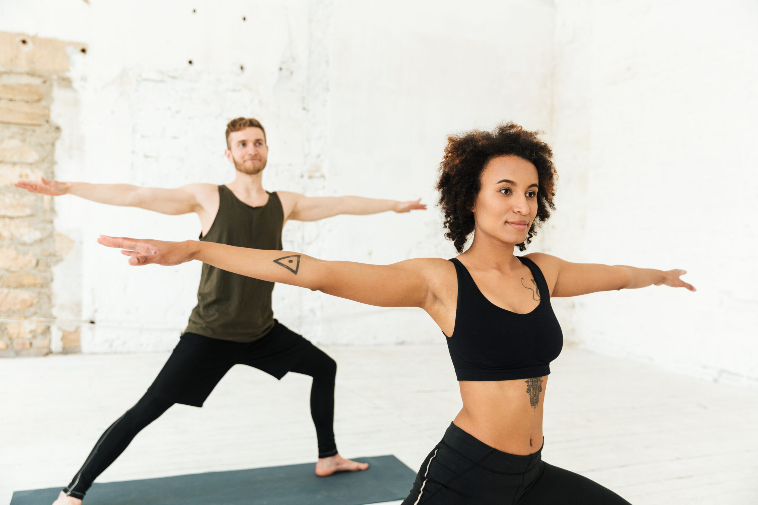 Man and woman do yoga
