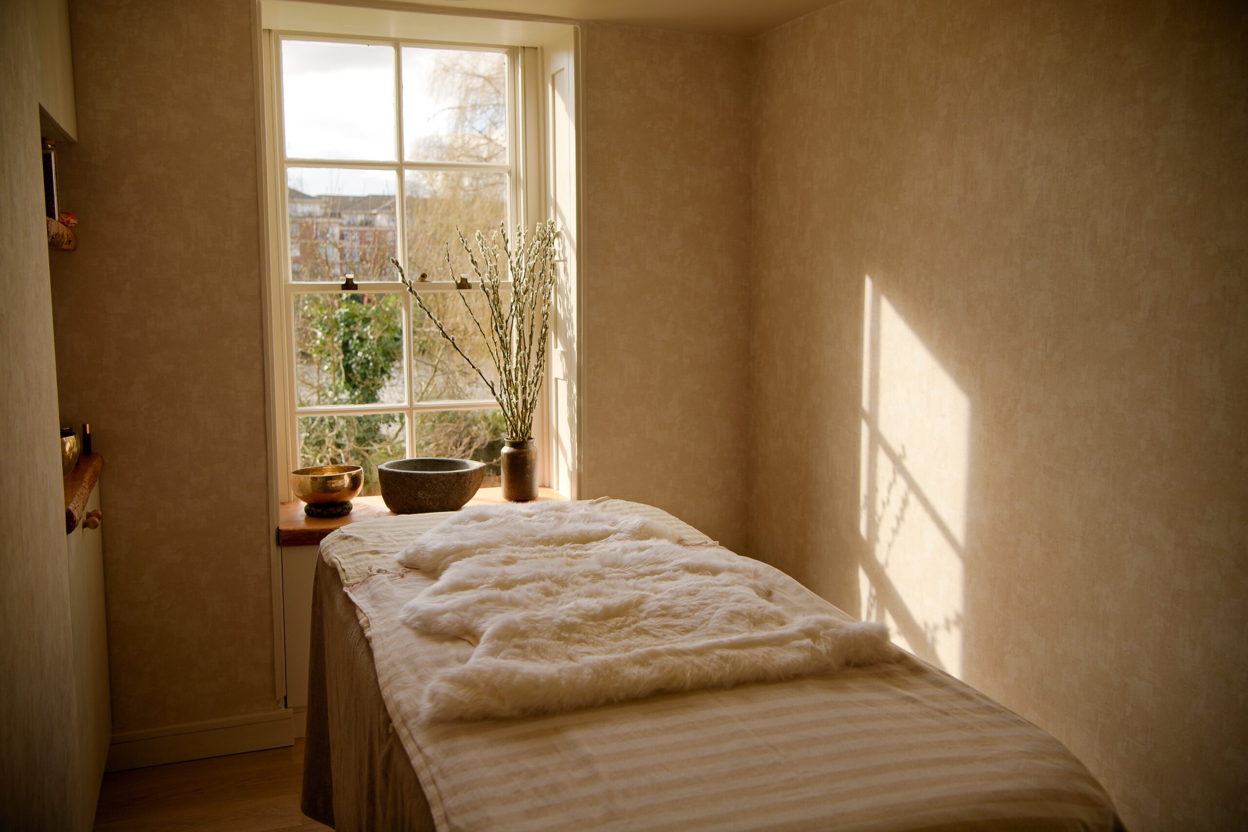 beige treatment room with shag rug and light coming in