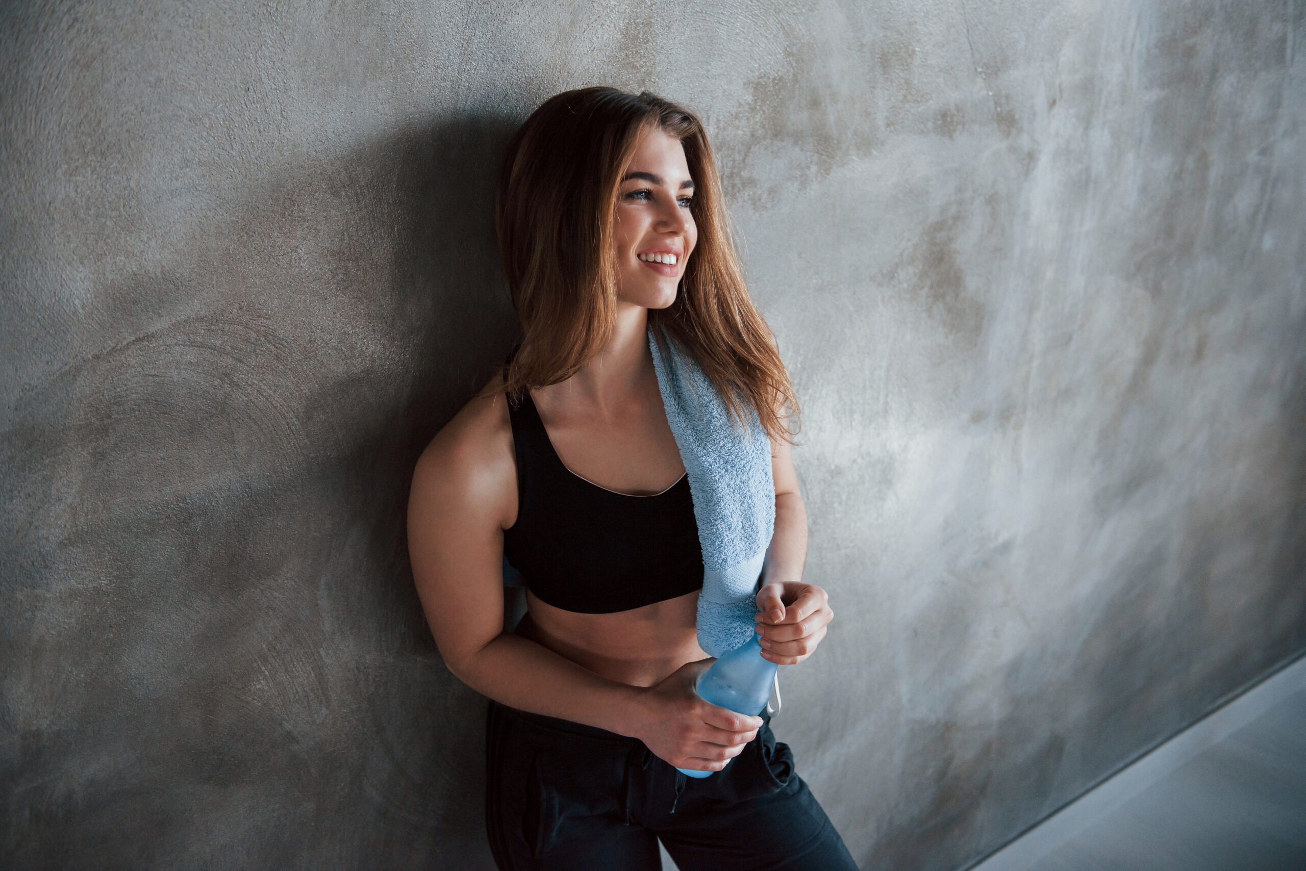 Woman rests against a wall