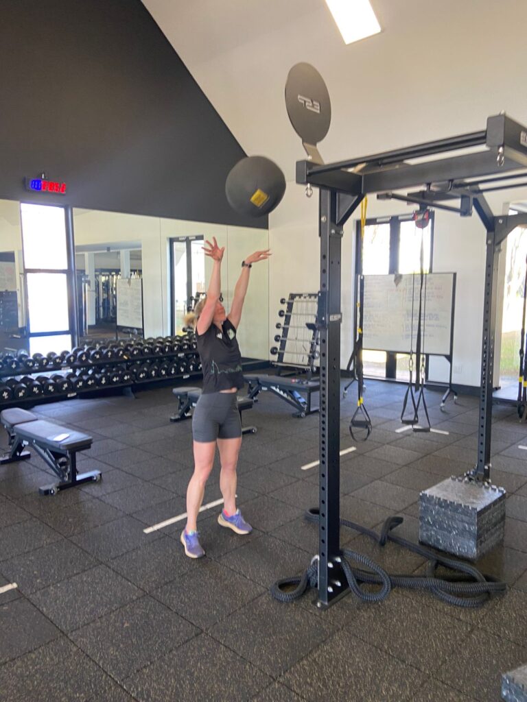 Shea Karssing does wall balls in her gym 
