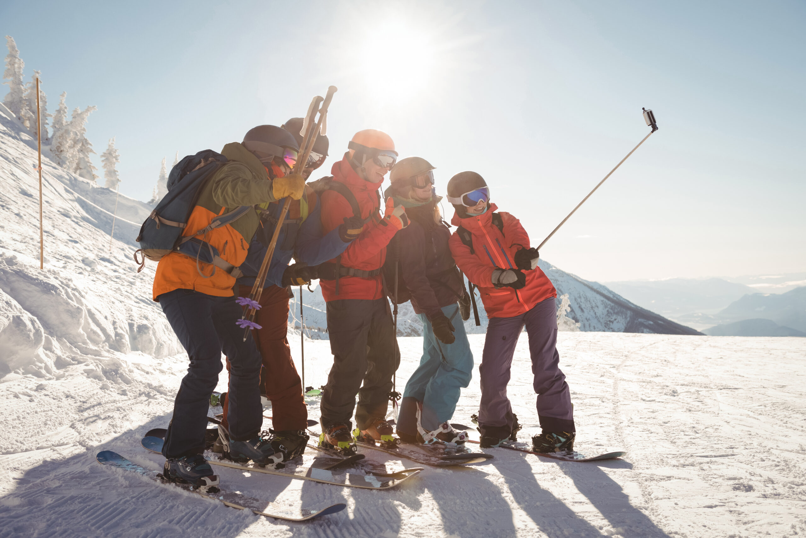 Group of friends take a selfie while skiing