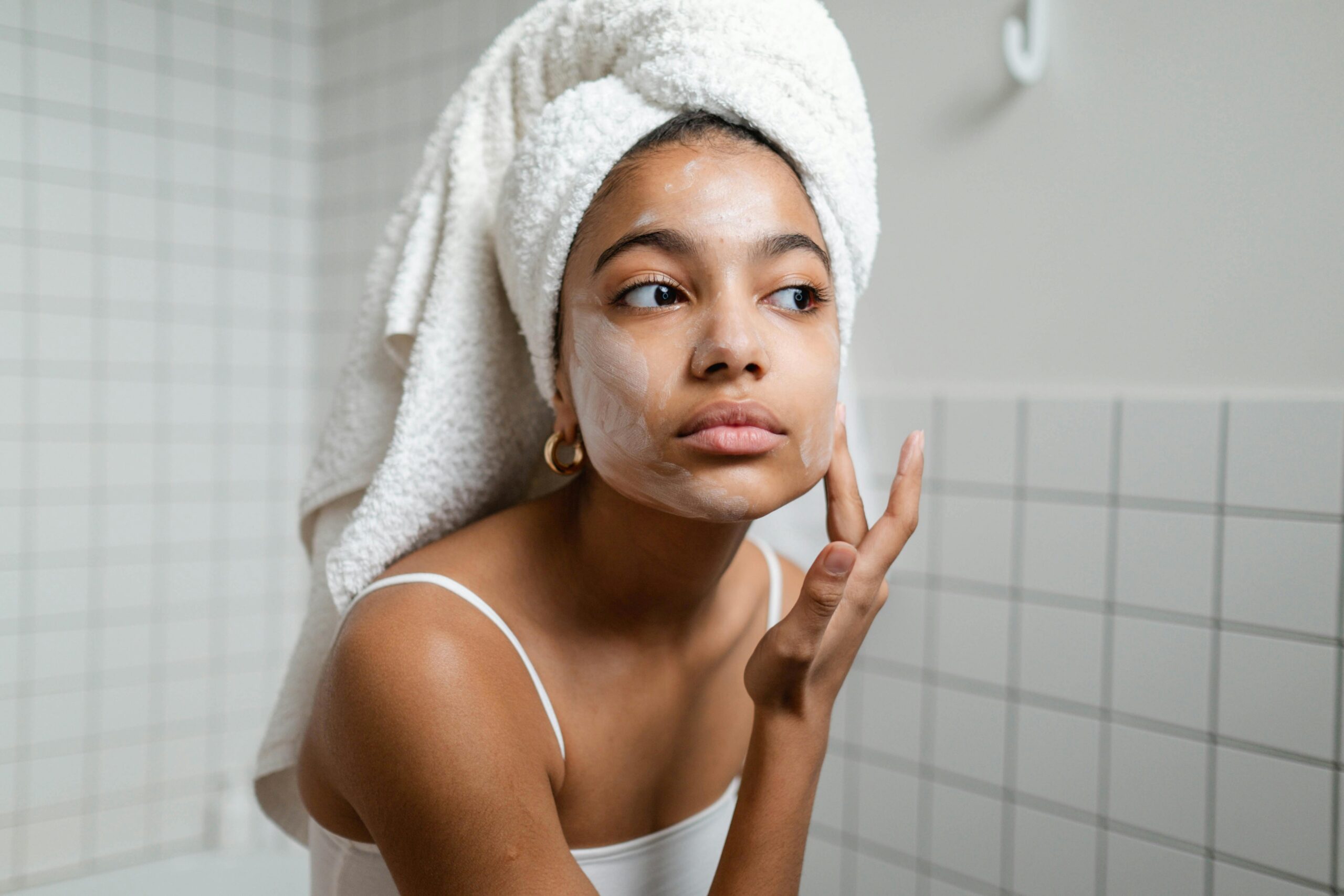 Woman applying skincare
