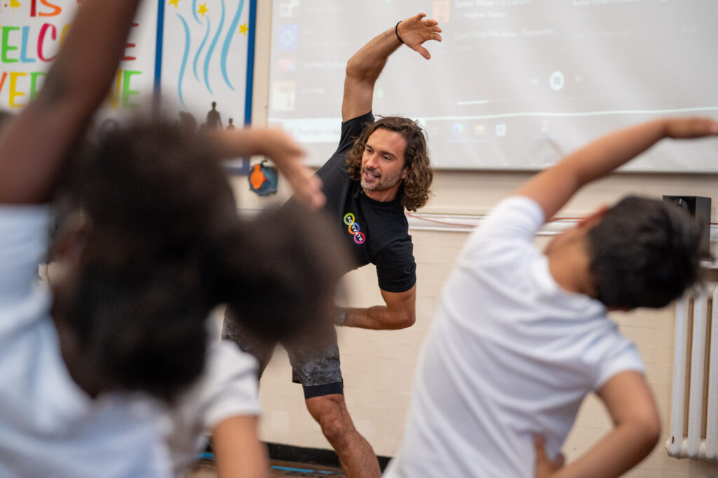Joe Wicks leads an exercise class at a local school