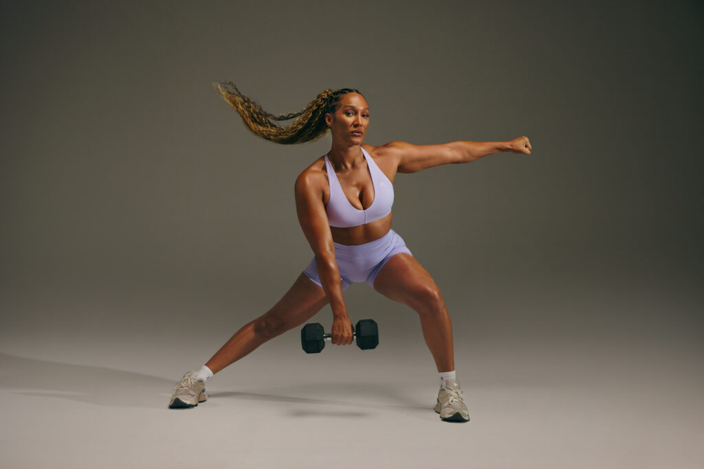 An Oner Active athlete lifts a weight