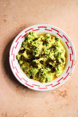 A vegetable curry dish in a patterned edge bowl.