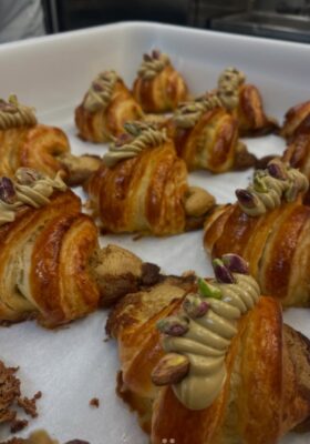 Croissants with pistachio cream piped on top