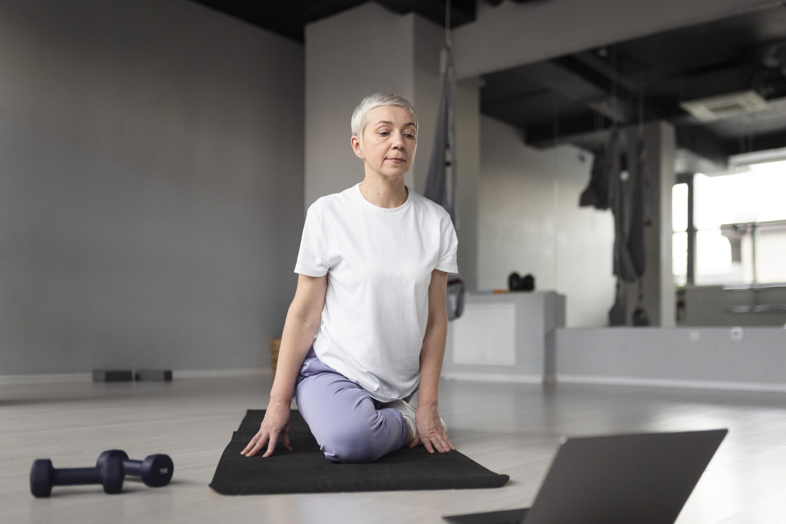 Elderly woman doing yoga
