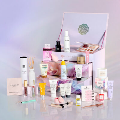 Glossybox 2024 Sent with Love Advent Calendar lilac three drawered box open with ribbons and products aid all around