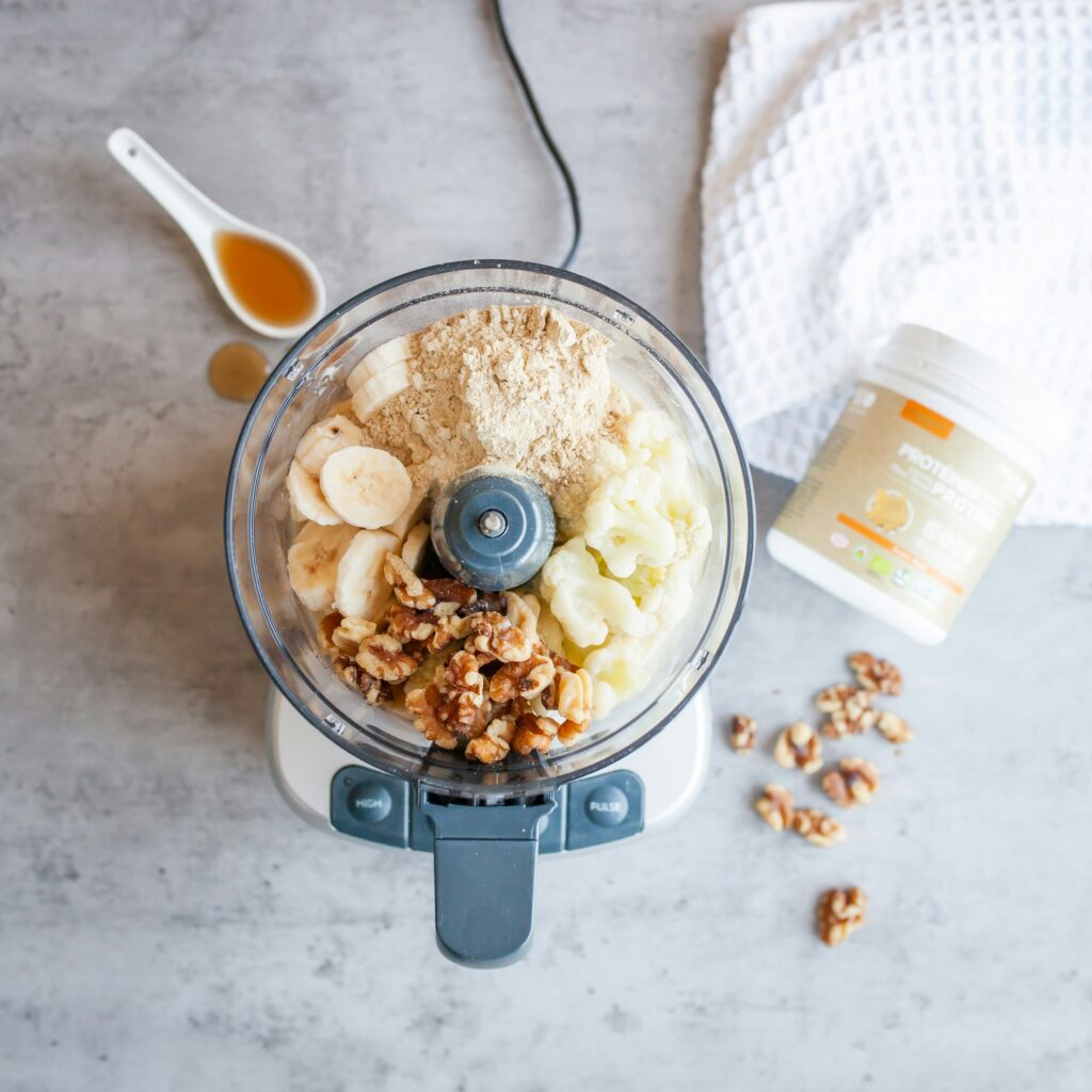 Protein powder and ingredients in a blender