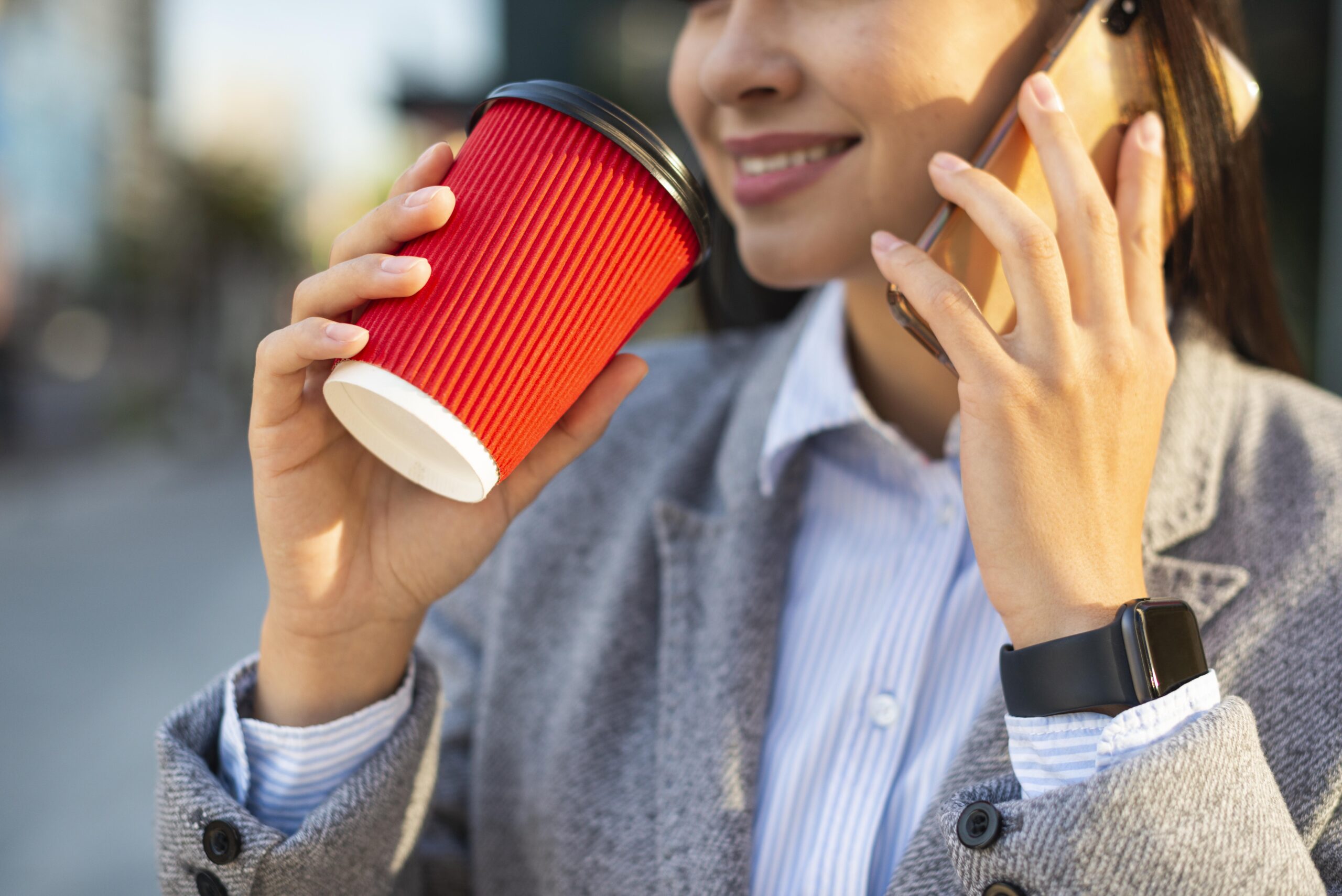 Woman drinking takeaway coffee