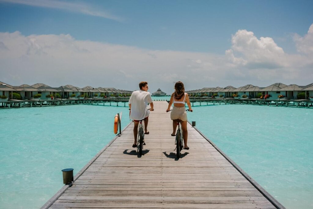 Couple on bicycles in Maldives 